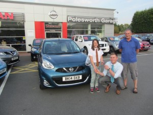 Mr Haywood and his Grandaughter Chloe being handed the keys for their New Nissan Micra from Liam