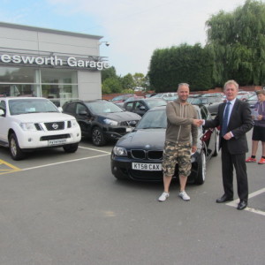 Lee Llewellyn collecting his BMW 1 Series from our Sales Executive Paul Tomson