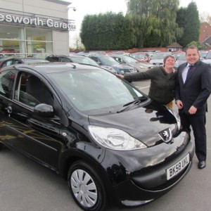 Miss Caroline Brindley-Walker collecting her Peugeot 107 from our Sales Manager Steve Sadler