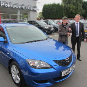 Mr Geoffrey Moss collecting his Mazda 3 from our Sales Executive Paul Tomson