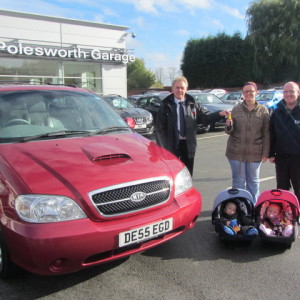 Mr & Mrs Mould & family collecting their Kia Sedona from our Sales Executive Paul Tomson
