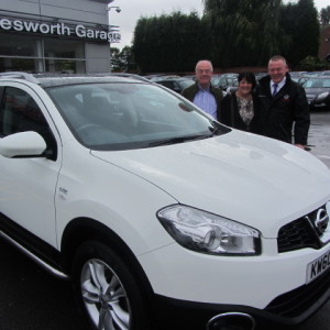 Mr & Mrs Smith collecting their Nissan Qashqai from our Sales Executive Roy Bettaney