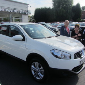 Mr & Mrs Woodley collecting their new Nissan Qashqai from our Sales Executive Mark Bolton