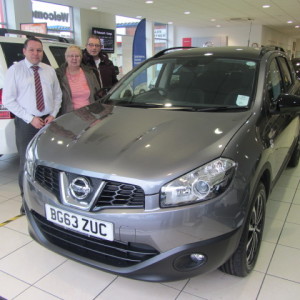 Mr and Mrs Sheriff collecting their new Qashqai +2 from our Sales Manager Steve Sadler