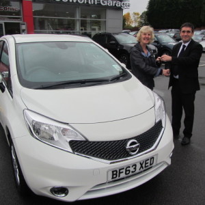 Mrs Margaret Johnson collecting her Brand New Nissan Note from our Sales Executive Mark Bolton