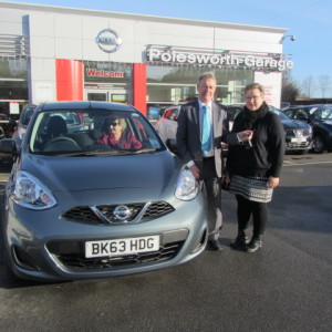 Returning customer Miss Beverley Ann Marsh collecting her new Nissan Micra from our Sales Executive Paul Tomson
