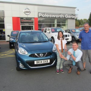 Mr Haywood and his Grandaughter Chloe being handed the keys for their New Nissan Micra from Liam