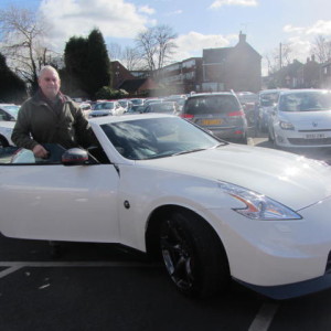 Mr Chris Clark getting ready to drive off in his dream car the Nissan 370Z Nismo