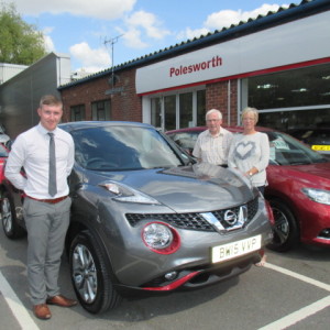 Mr & Mrs Rowley collecting their New Nissan Juke With The Red Exterior Pack Fitted From Our Sales Executive Adam Hickinbottom