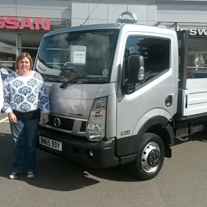 Miss Kennedy Of J P Fencing Collecting The Companys New Nissan Cabstar Dropside From Our Sales Manager Steve Sadler