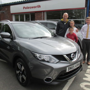 Mr David Cleaver And His Children Anna And Will Collecting Their New Nissan Qashqai From Our Sales Executive Adam Hickinbottom