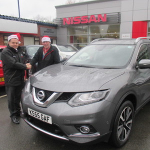 Mr Glenn Feet And Our Sales Manager Steve Sadler Getting Into The Christmas Spirit Whilst Taking Delivery Of His New Nissan X Trail 7 Seater